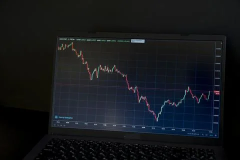 Laptop display with a graph of the movement of crypto currency. Stock Photos