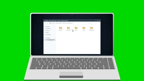 Laptop displaying image gallery thumbnails on green background. 4K 스톡 동영상 341694630