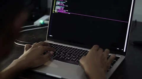 Laptop Displaying Programming Code in Software Development Workspace 库存影片 340450453