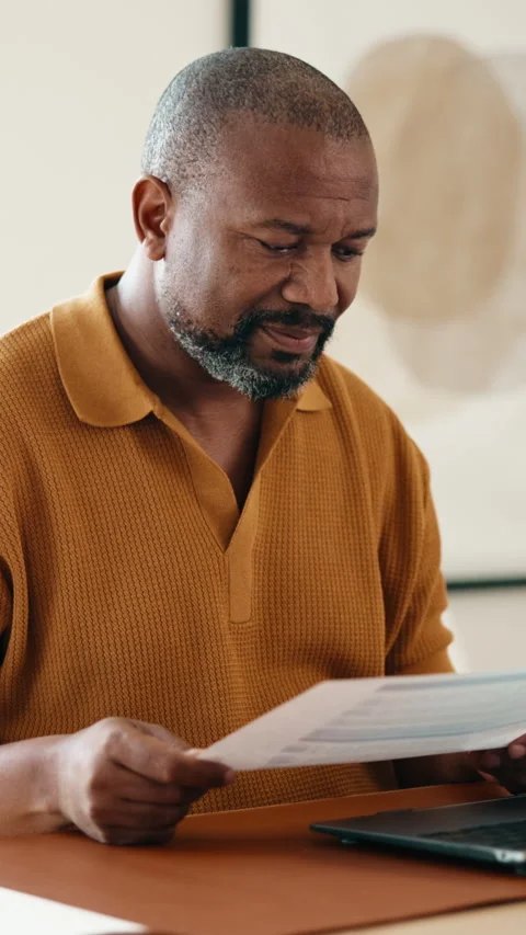 Laptop, document and black man in home with remote work, administration or Stock Footage 338009606