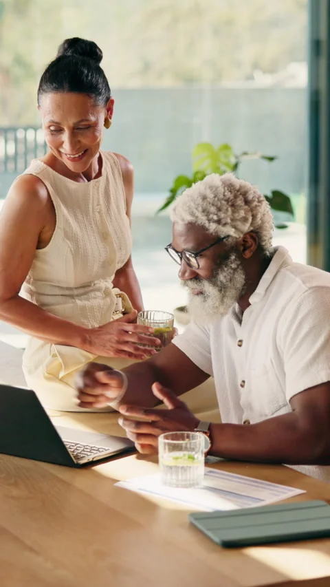 Laptop, documents and interracial couple in home for finance, investment or 動画素材 346280327