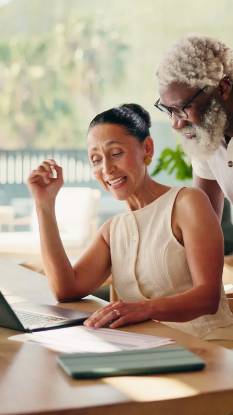 Laptop, documents and interracial couple for finance, investment or budget 動画素材 346280594