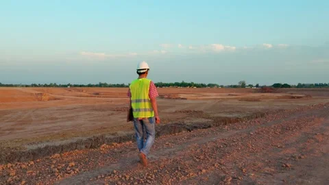 With a laptop, engineers are inspecting the area where a canal  will be dug for  Stock Footage 205070856