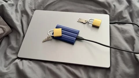Laptop With External SSD Padlocks and Keys for Cyber Security Concept Stock Footage 340407537