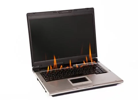 Laptop with flame on keyboard Stock Photos