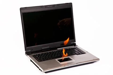 Laptop with flame on touchpad Stock Photos