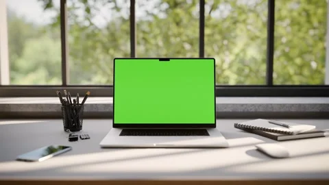 Laptop Frameless with Green Screen on Office Desk in Minimalistic Sunny Int.. Stock Footage 341851896