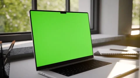 Laptop Frameless with Green Screen on Office Desk in Minimalistic Sunny Int.. Stock Footage 341851898