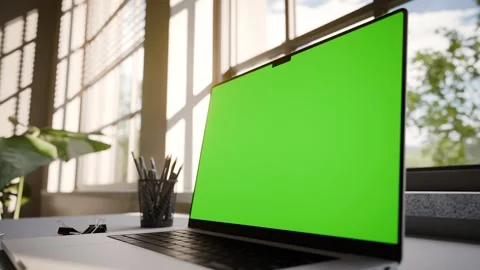 Laptop Frameless with Green Screen on Office Desk in Minimalistic Sunny Int.. Stock Footage 341851899