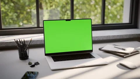 Laptop Frameless with Green Screen on Office Desk in Minimalistic Sunny Int.. Stock Footage 341851907