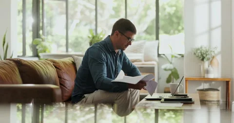 Laptop, freelancer and documents with man on sofa for blog writer, virtual Stock Footage 329365071