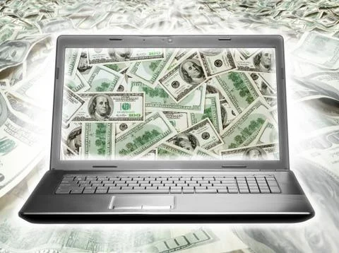 Laptop full of dollars Foto stock