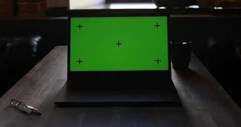 Laptop With Green Screen and Tracking Dot. Dark office. A Man's Hand Opens The Stock Footage 127001487