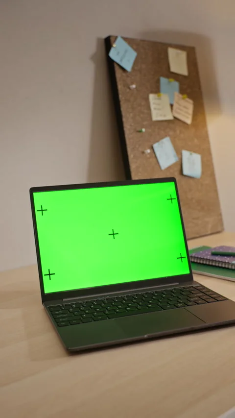 Laptop with Green Screen Chroma Key Displaying on Desk for Mockup Stock Footage 345490007