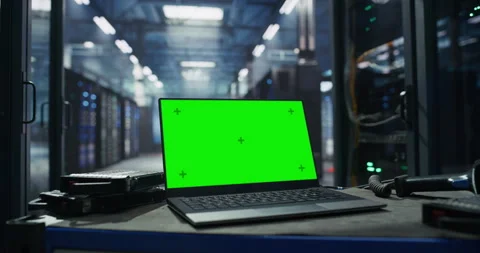 Laptop with Green Screen in Data Center with Server Racks Stock Footage 319999985