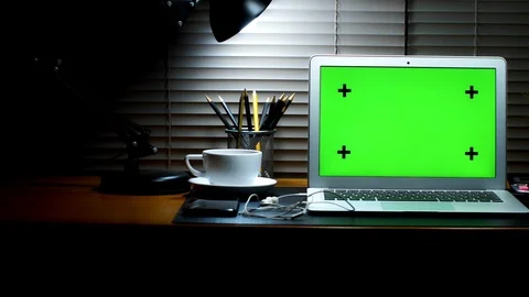 Laptop with green screen display. Dark home office. Stock Footage 105772995