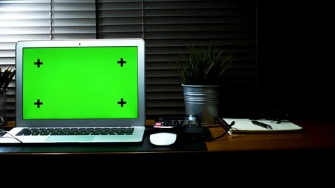 Laptop with green screen display. Dark home office. Stock Footage 105773882