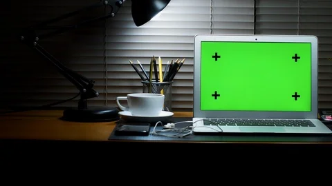 Laptop with green screen display. Dark home office. Stock Footage 105775046