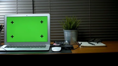Laptop with green screen display. Dark home office. Stock Footage 105777962
