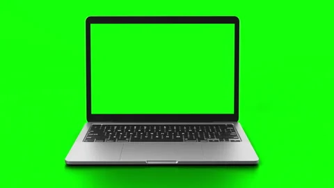 Laptop with green screen on display rotates into view in front of greenscreen. Stock Footage 260135734