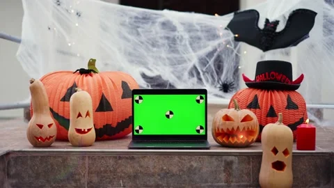 A laptop with a green screen with dots for tracking movement against the Stock Footage 219756527