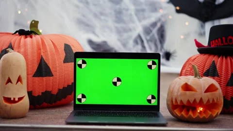 A laptop with a green screen with dots for tracking movement against the Stock Footage 250527094
