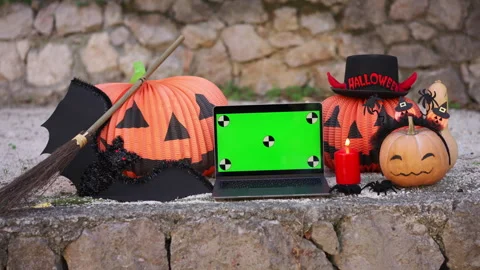 A laptop with a green screen with dots for tracking movement against the Stock Footage 289129058