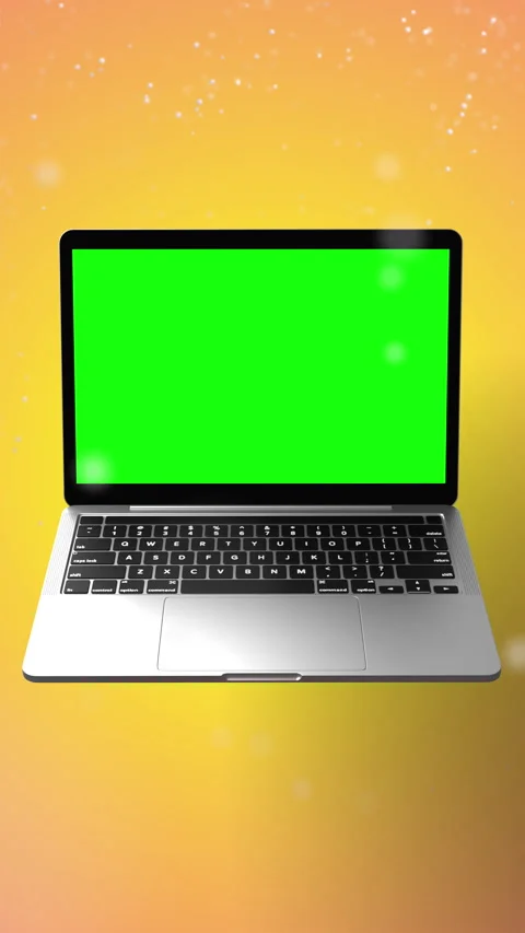 Laptop with green screen in front of yellow backdrop with snow Stock Footage 282401276