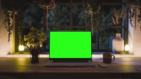 Laptop green screen mockup front view zoom in on desk with warm night light.. Stock Footage 320005584
