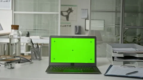 Laptop with Green Screen Mockup Sitting on Doctor Office Desk Stock Footage 339785077