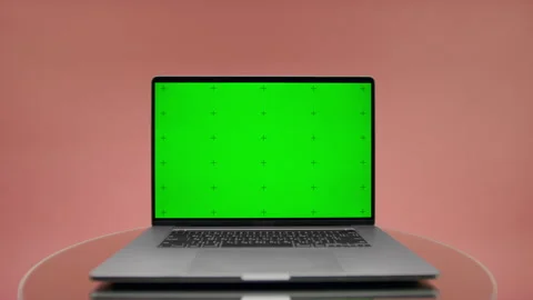 Laptop With Green Screen on Pink Background Stock Footage 334838742