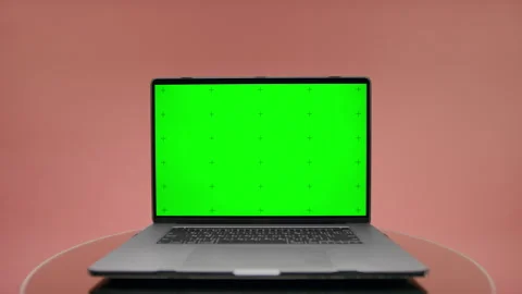 Laptop With Green Screen on Pink Background Stock Footage 340875405