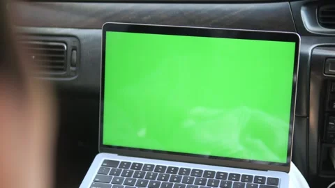 Laptop with green screen placed inside car dashboard Stock Footage 341176748
