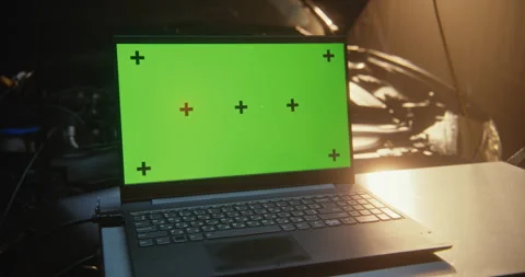 Laptop with Green Screen on Toolbox in Modern Auto Workshop Stock Footage 330267257