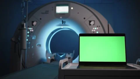 Laptop with a green screen, turning on the light in the MRI or CT room Stock Footage 300017643