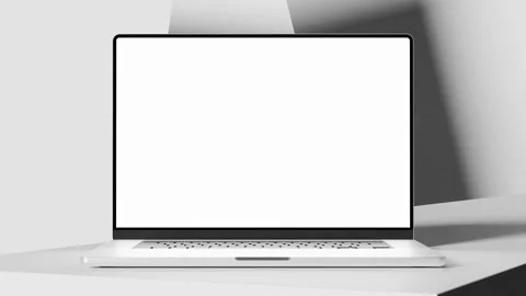 Laptop with a green screen on a white table, smooth zoom in, abstract movin.. Stock Footage 276371420