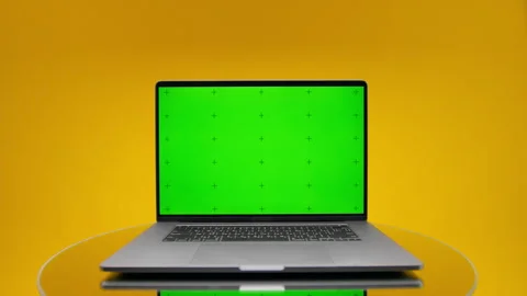 Laptop with green screen on yellow background Stock Footage 334367059