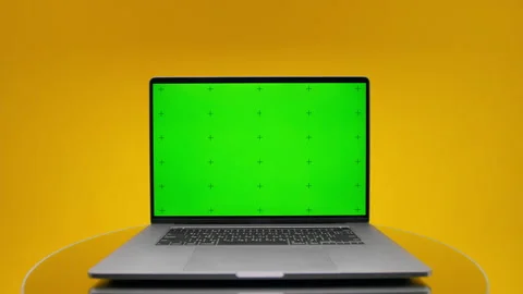 Laptop green screen on yellow background Stock Footage 334712123