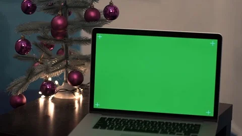 Laptop greenscreen on a background christmas tree Stock Footage 69834895