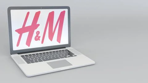 Laptop with H M logo. Computer technology conceptual editorial 3D rendering 스톡 일러스트