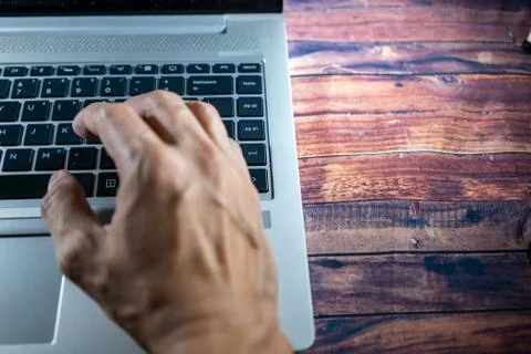 Laptop with a hand while typing or encoding. Business concept, office concept Foto stock