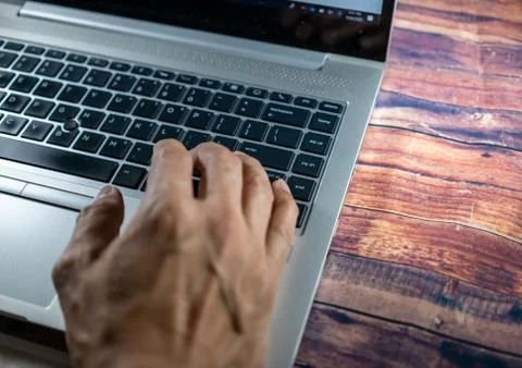 Laptop with a hand while typing or encoding. Business concept, office concept Foto stock