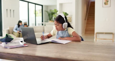 Laptop, headphones and child with elearning in house with studying for test Stock Footage 335327491