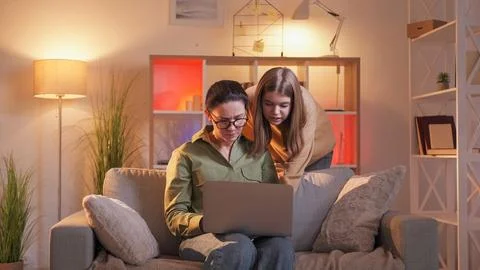 Laptop help computer explaining daughter mother Stock Photos