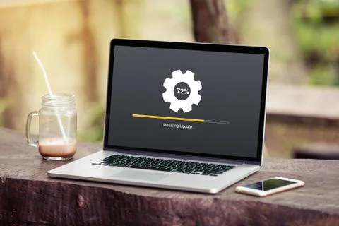 Laptop with Installing update process with gearbox percentage progress Stock Photos