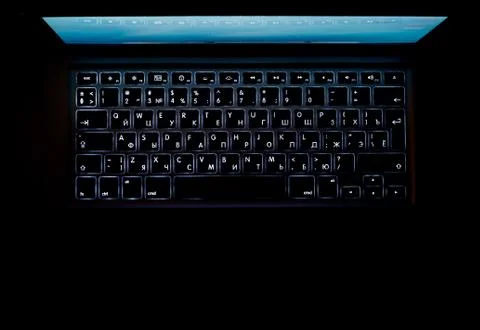 Laptop isolated in dark Stock Photos