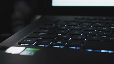 Laptop keyboard with blue LED backlight Stock Footage 221459097