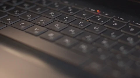 Laptop keyboard close-up. Close-up dolly shot of desktop keys  Stock Footage