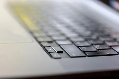 Laptop keyboard in close focus. Computer hardware and technology detail. Stock Photos