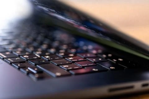 Laptop keyboard close up with soft focus. Computer technology detail in war.. Stock Photos